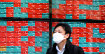 Australia shares hit record high; Japan stocks end lower, while yen languishes near 34-year lows 